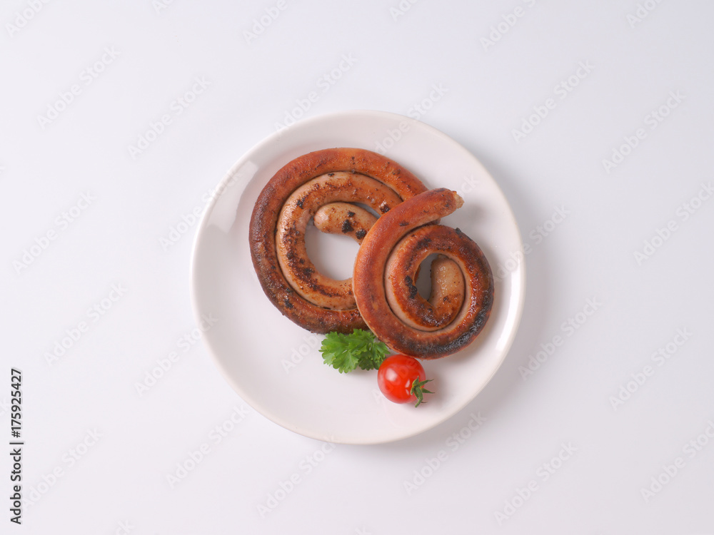 Poster pan fried white wine pork sausages