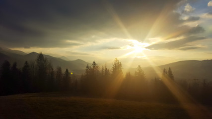 Fototapeta na wymiar Sun, sunset over a mountain valley