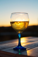 Cooled white wine on the sunset.