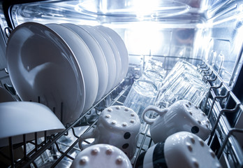 Interior of dishwasher machine with clean dishes © leszekglasner