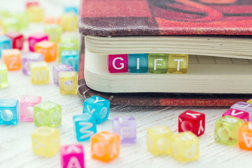 Multi-colored Blocks with the word Gift.