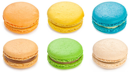A lot of colorful macarons isolated on white background.