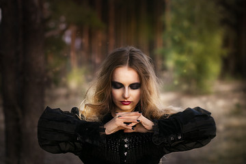 Halloween. beautiful girl witches in the woods with pumpkins © mak_alexandra