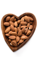 Top view dried almond in wood bowl on white background.
