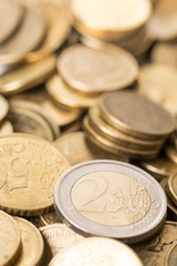 Two euro money metal coin on the pile of metal euro coins