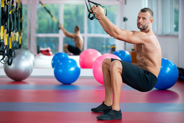 Naklejka premium guy training with trx