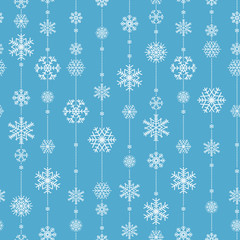 Christmas seamless pattern from snowflakes on blue background.