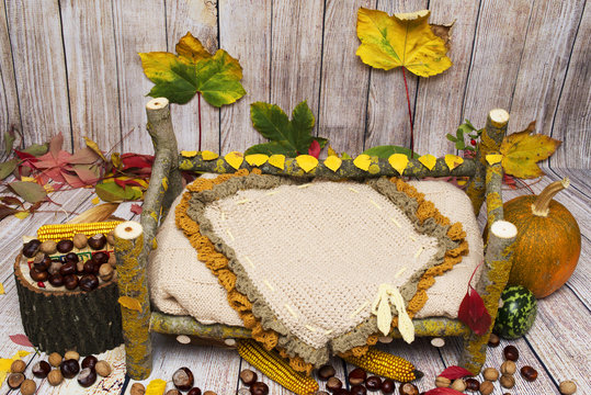 Autumn arrangement for new baby and baby photography,autumn decoration for studio photography made of a wooden bed made of hand, pumpkins, fruits, corn