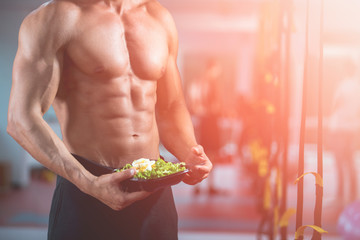 guy eating salad gym fitness