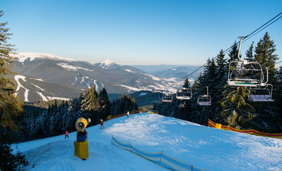 Beautiful winter landscape at ski resort copyspace people riding ski-lift to the top of the mountain lifestyle travelling tourism seasonal sports extreme concept
