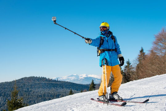 Shot of a professional skier taking a selfie using selfie stick posing on the slope copyspace recreation active sport seasonal resort sportspeople adrenaline extreme concept