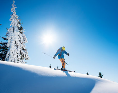 Full length shot of a professional freeride skier skiing on top of the mountain copyspace active people living leisure hobby extreme slope snow winter seasonal sport