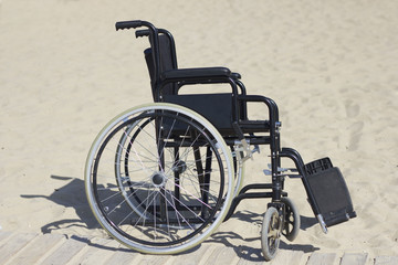 Wheelchair on a track to the beach