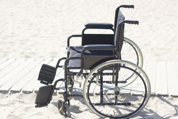 Wheelchair on a track to the beach