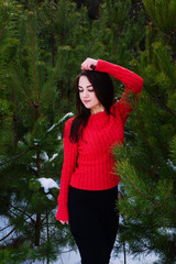 Beautiful young girl in a white winter forest