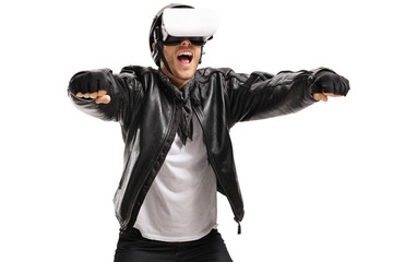 Excited biker with a VR headset pretending to drive a motorcycle