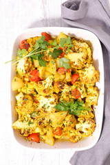 baked cauliflower with cream, curcuma and coriander