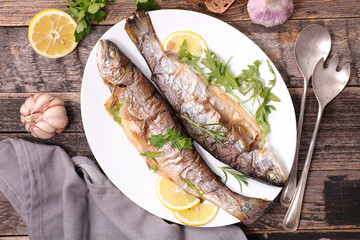 grilled fish with herbs and lemon