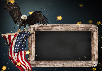 Empty wooden table with bald eagle and USA flag background.