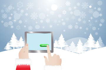 View of finger of Santa Claus touching green button Subscribe in tablet.  Winter snowy  landscape is in the background. 