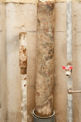 rusty water pipe after thirty years of operation. Corrosion inside a pipe. Water filter. Replacement of water supply. Repair in a bathroom. Old pipes of communications. Need to clean a tap water