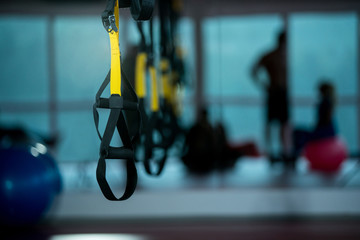 trx fitness straps in gym - obrazy, fototapety, plakaty