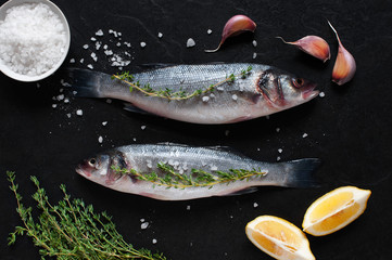 Two fresh raw fishes with salt