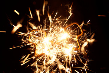 Burning sparkler in form of a tree