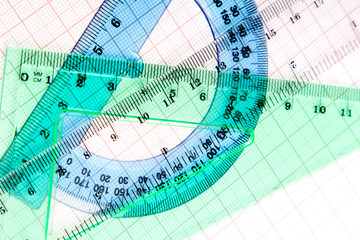 drawing tools on blue graph paper with copy space