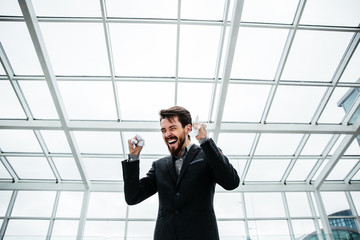 Businessman grasped in the hands of the sheets of paper