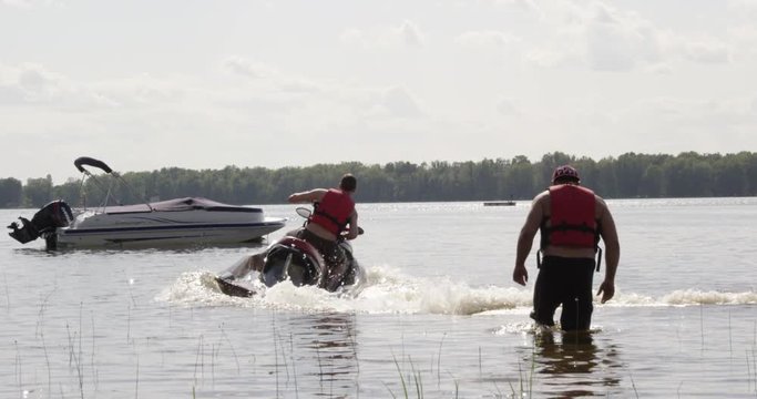 Man on seadoo turns and speeds away- slow motion
