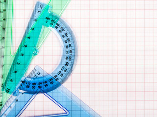drawing tools on blue graph paper with copy space