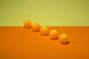 Abstract still life with orange balls on a colorful background