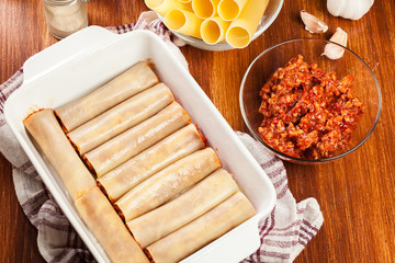 Cannelloni stuffed with meat cooked in a casserole dish ready fo
