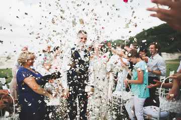 Happy wedding couple walking in a botanical park