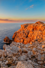 Punta Nati cape at sunset light