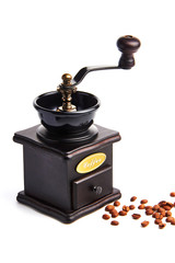 Manual coffee grinder./A hand grinder with coffee beans.