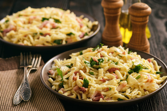 Spaetzle with bacon and onion, german style cuisine.