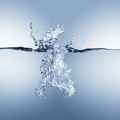 Dramatic blue water splash, water drops and air bubbles isolated on white