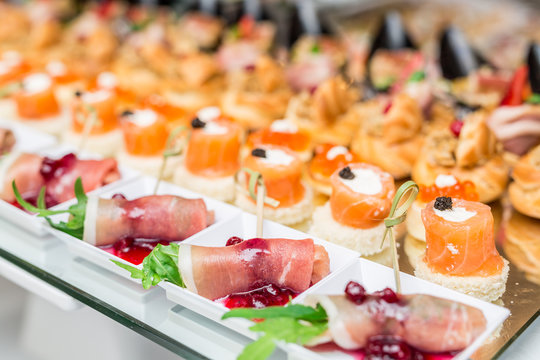 Gourmet appetizers: caviar, venison, tuna and salmon.
