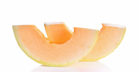 pieces of Cantaloupe on white background