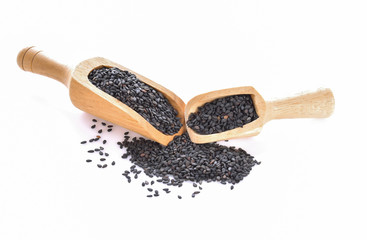Black sesame in scoop on a white background