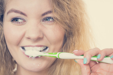 Woman brushing cleaning teeth