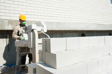 Construction mason making a brickwork