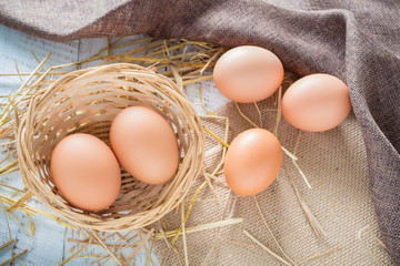 Eggs in a basket for cooking.