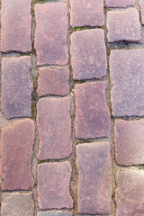 Background old granite paving stones in old town