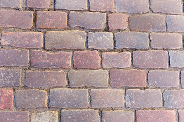 Background old granite paving stones in old town