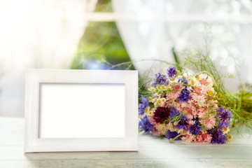 Frame mockup and bouquet in the background