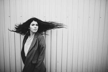 Portrait of stylish modern young curly woman