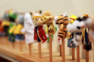 Toy puppets on wooden sticks for preschool nursery theatre. Puppet theatre art.